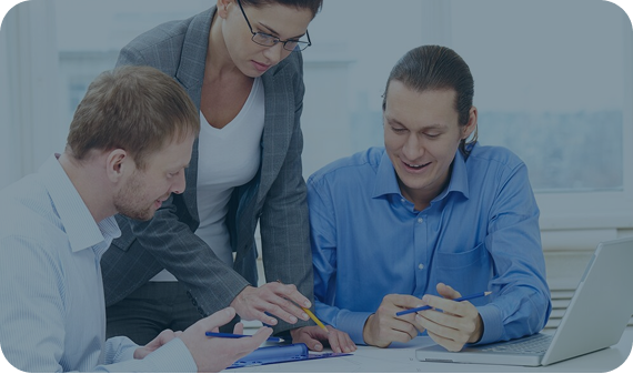 3 individuals looking at investment paperwork